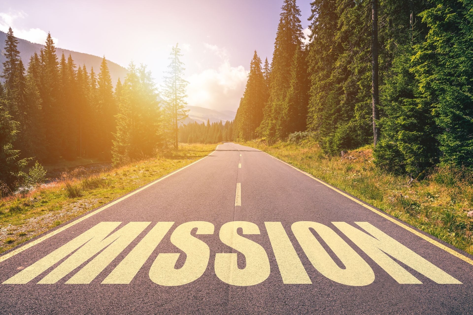 Mission word written on road in the mountains